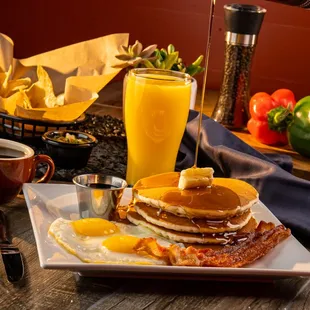 Slam breakfast Eggs, 2 slices of bacon or 2 sausage links and 3 pancakes. with Coffee or Juice included.