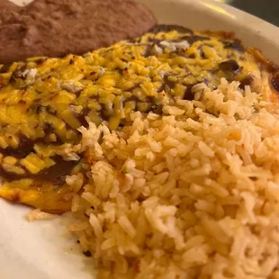 Cheese enchiladas, rice and refried beans