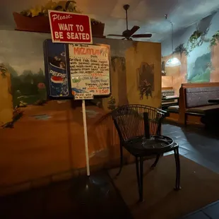 a chair and a sign