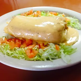 Chimichanga, smothered in queso sauce.