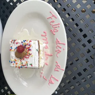 a plate with a piece of cake on it