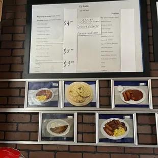 a menu on a brick wall