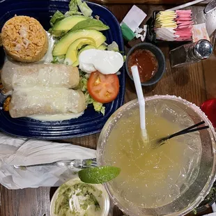 Chicken avocado Enchiladas and lime on the rocks marg!