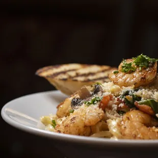 a plate of pasta and shrimp
