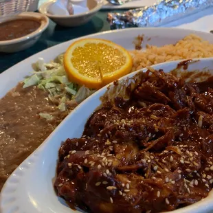 Mole plate with rice and beans, served with corn or flour tortillas.