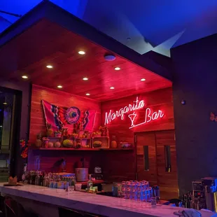 a bar with a neon sign