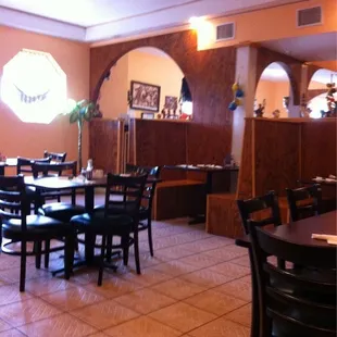 a dining room with tables and chairs