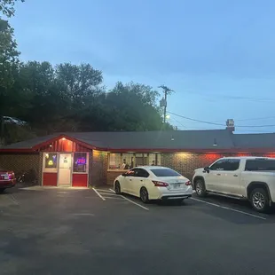 The entrance isn't visible from the road if there are cars in the lot.