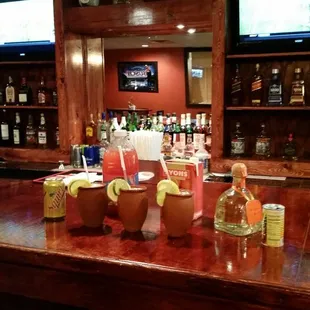 a bar with a variety of drinks