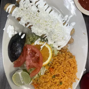 Chicken flautas, rice with vegetables, side salad.