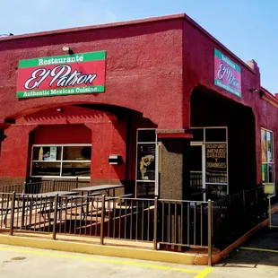 a red building with a sign that says el patron