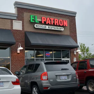 cars parked in front of a mexican restaurant