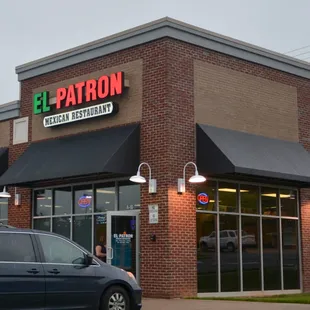 a car parked outside of a restaurant