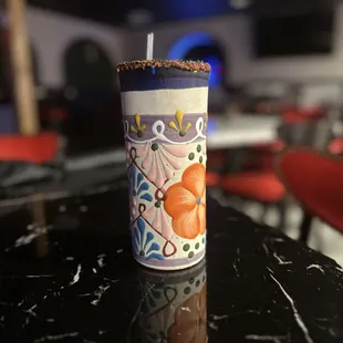 a lit candle on a table