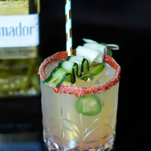 a margarita with cucumber and lime