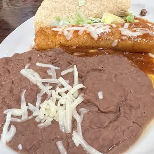 Lunch Taco, enchilada, refried beans.