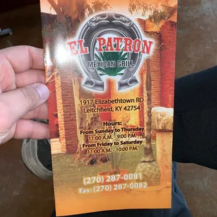 a person holding a menu