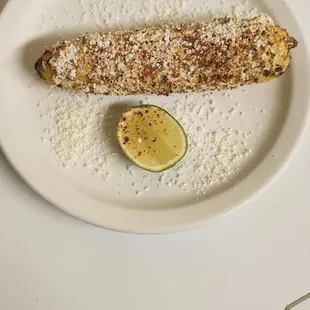 a plate of corn and a lime
