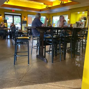 a man and a woman sitting at a table in a restaurant