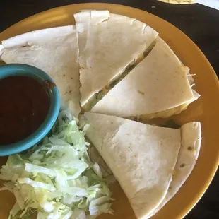 Cheese quesadilla with a side of red Chile