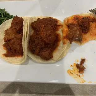 Tacos de lengua in this chile rojo sauce