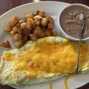 Three egg omelette with choices of ingredients. Homemade tortillas, spiced potatoes and choice of beans, hash browns and more