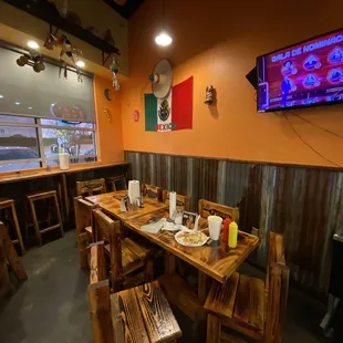 a restaurant with a flat screen tv