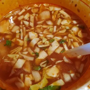 a bowl of soup with a spoon