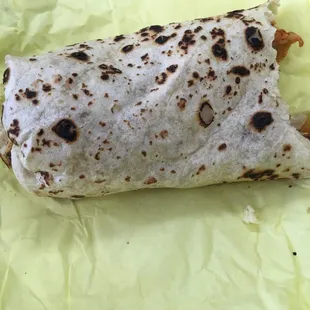 Half of my breakfast burrito I appreciate the charing on the tortilla makes for fond memories of my childhood lol