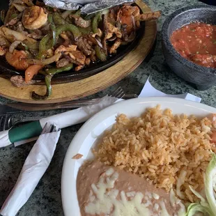 Fajitas with steak, shrimp, and chicken