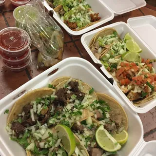 3 Rolled Tacos, 1 Beef Taco, and 1 Bean Tostada