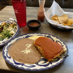 Lunch special #1, taco, chilli-rehilano (sp?), refried beans, complementary chips and salsa.