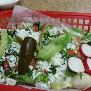 Two tacos with lots of ingredients!