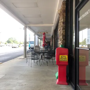 a red fire hydrant on the sidewalk