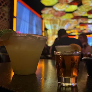 a margarita and a glass of tequila