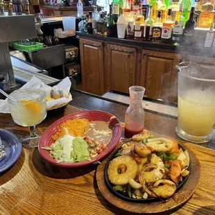 Shrimp Fajitas with pineapple paired with a pitcher of margaritas.