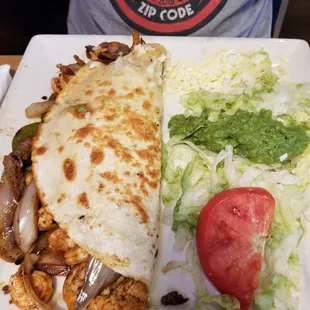 Chicken, beef and shrimp something.  I don't know exactly what he ordered.