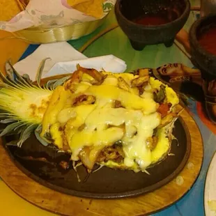 The pineapple fajita WASN'T on the printed menus. It was a special. Cheese on top with chicken, onions, bell peppers, and pineapple!
