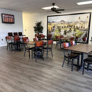 a restaurant with tables and chairs