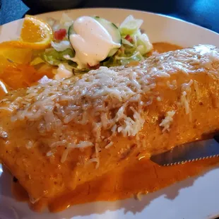 Pastor burrito mojado w creamy spicy salsa