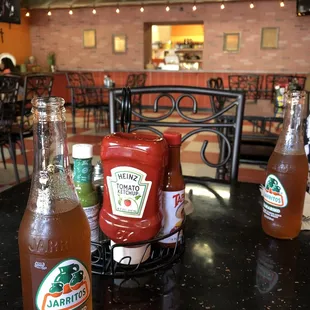 Clean dining area and neat full condiments