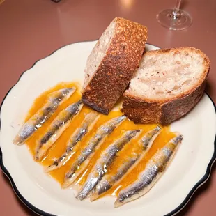a plate of fish and bread