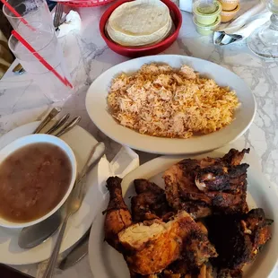 Full chicken, rice (cooked in chicken broth and garlic, yum!), corn tortillas and pinto beans.