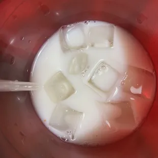 ice cubes in a bowl of milk