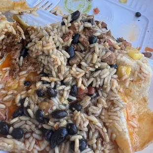 Super watery falling apart dripping mess el pastor burrito with a tablespoon of pork.