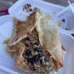 Super watery falling apart dripping mess el pastor burrito with a tablespoon of pork.