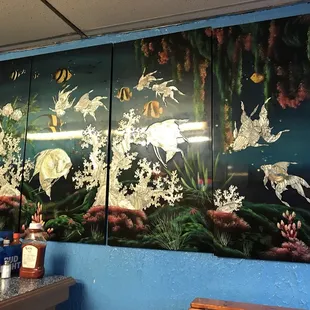 a mural of birds and flowers