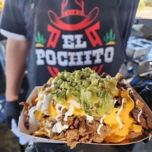 a man holding a taco