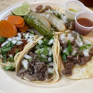 Chorizo, cabeza, lingua, and tripa tacos