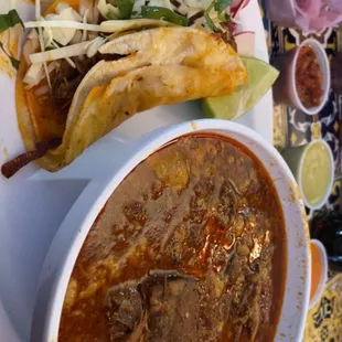 Birria De Res-slow cooked beef that came with cilantro, onions, and slightly crisp taco with the meat in it.